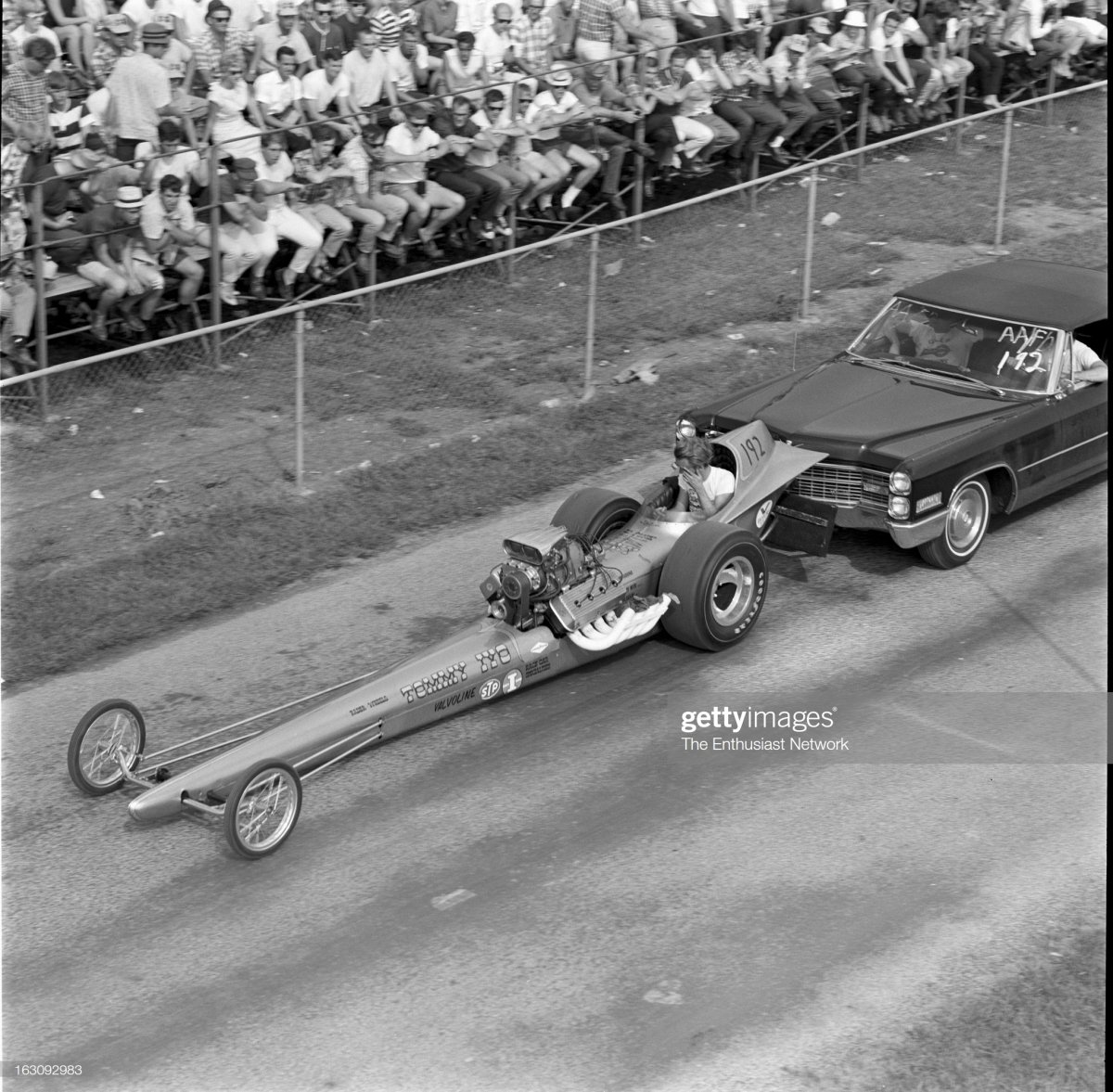 1  Tommy Ivo With Dragster pushed by caddy back to pits.jpg