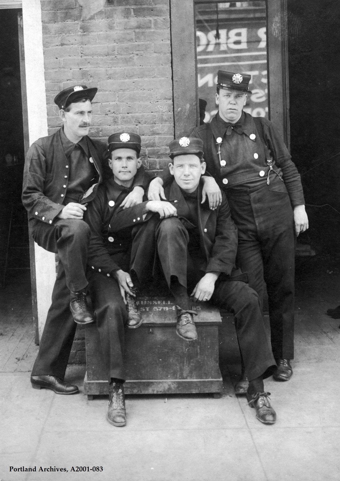 four-firefighters-from-truck-5-posing-outside-station-8.jpg
