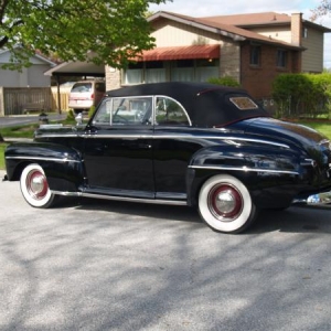 Our 1947 Ford rag top with a Flattie, Fenton intake twin 97's, stock trans and rear axle.