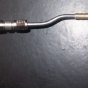 3/16" stainless hard line will just about fit inside the barbed end of a brass rollover valve/ vent.  I machined it down just a bit to fit in tightly.