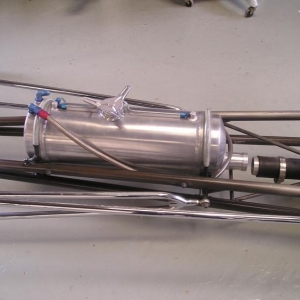 I mounted an old Moon tank to look old style w/ faux spring mounts. Also made the 2 1/2 "
 fuel log/feed pipe
