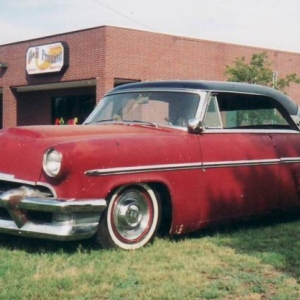 I've always wanted a '54 Mercury Monterey hardtop and finally found one that is perfect for me. Its a little ragged on the outside, but it's all fresh underneath: 5.0 HO SEFI / AOD from a '92 Lincoln MK VII LSC coupe, 9-inch rear axle, power steering, power disc brakes, dropped spindles, etc., etc. It's a runner/driver in need of TLC. This photo was taken almost 10 years ago, before the PO monkeyed with the suspension to RAISE IT! Argggg!