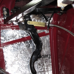 Early V8 Ford e-brake modified to fit.  I used components from Lokar.  I had to weld couplings to rear baking plates to attach cables.  worked out well.