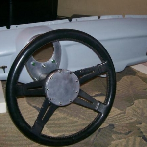 Dashboard filled and smoothed w/handmade speedo bezel.  Steering wheel hub is also handmade from a stock Met wheel center.