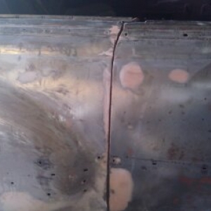 look at that door seam!!!  cut, weld, grind & file; weld, grind & file...repeat all the way down.  Nickle tight all the way down baby!!!