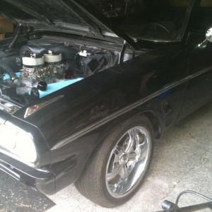 Installing the matching two fours and progressive linkage to the already potent Pontiac !