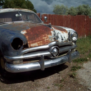Right fender with headlight removed, gonna have to get new fenders or just french the headlights in to fill the rust under them,