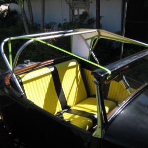 Folding top bows I made from 3/4in. EMT an a windsheild header of wood with two little homemade scockets screwed to it,so it will lock to post tops with wingbolt.