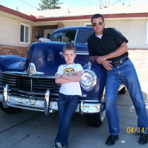 Me and our '47 and '02 Hudsons.  The '02 is the boy.
