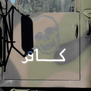 It supposedly says "Infidel" in Arabic.